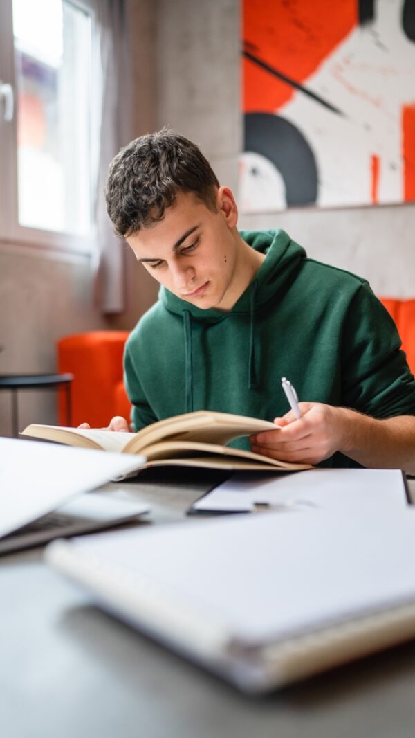 One,Young,Man,Caucasian,Teenager,Student,Learning,Study,Reading,Book