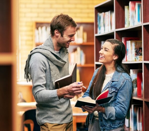 People,,Students,And,Library,Discussion,With,Books,,Happy,And,Campus